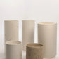 Collection of five concrete basins in varying heights and finishes