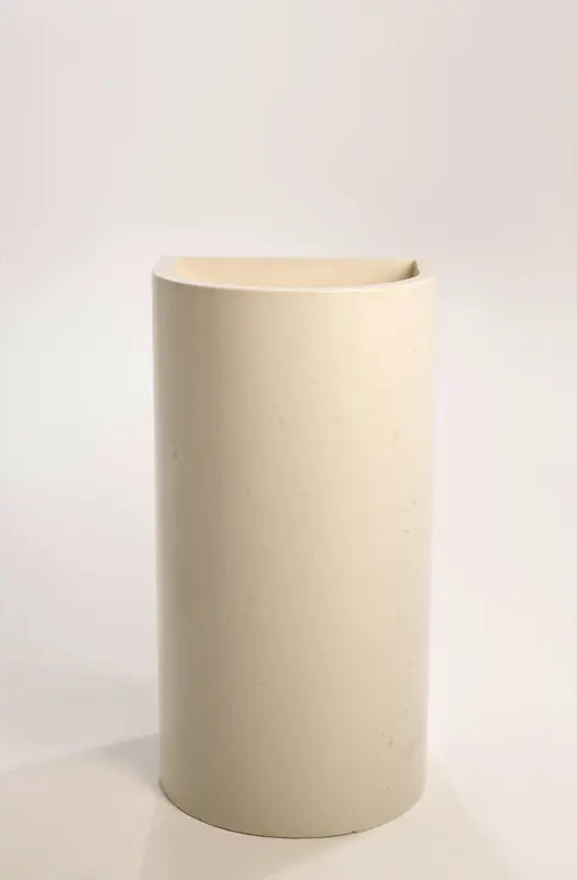 A front view of a polished concrete full-height half-moon pedestal basin in a smooth beige finish, displayed against a plain background.