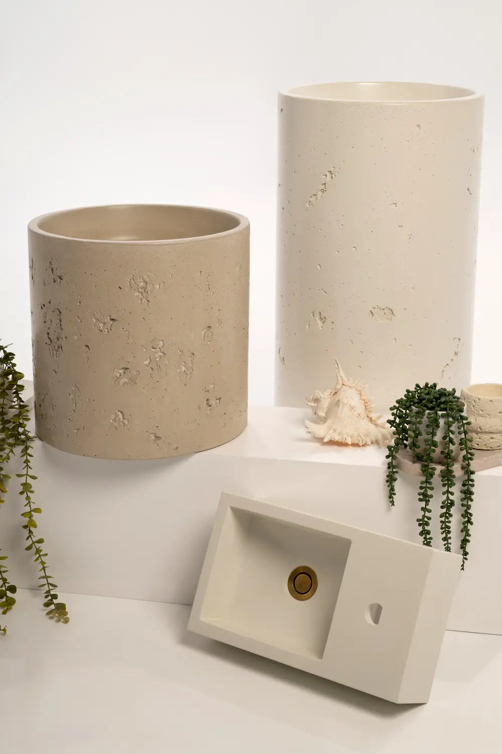 Polished rectangular basin styled with tropical plants and seashell