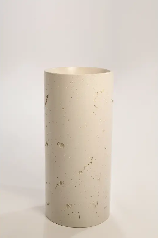 A concrete textured full-height round pedestal basin displayed alongside a shorter textured pedestal and colour swatches showing various finish options.