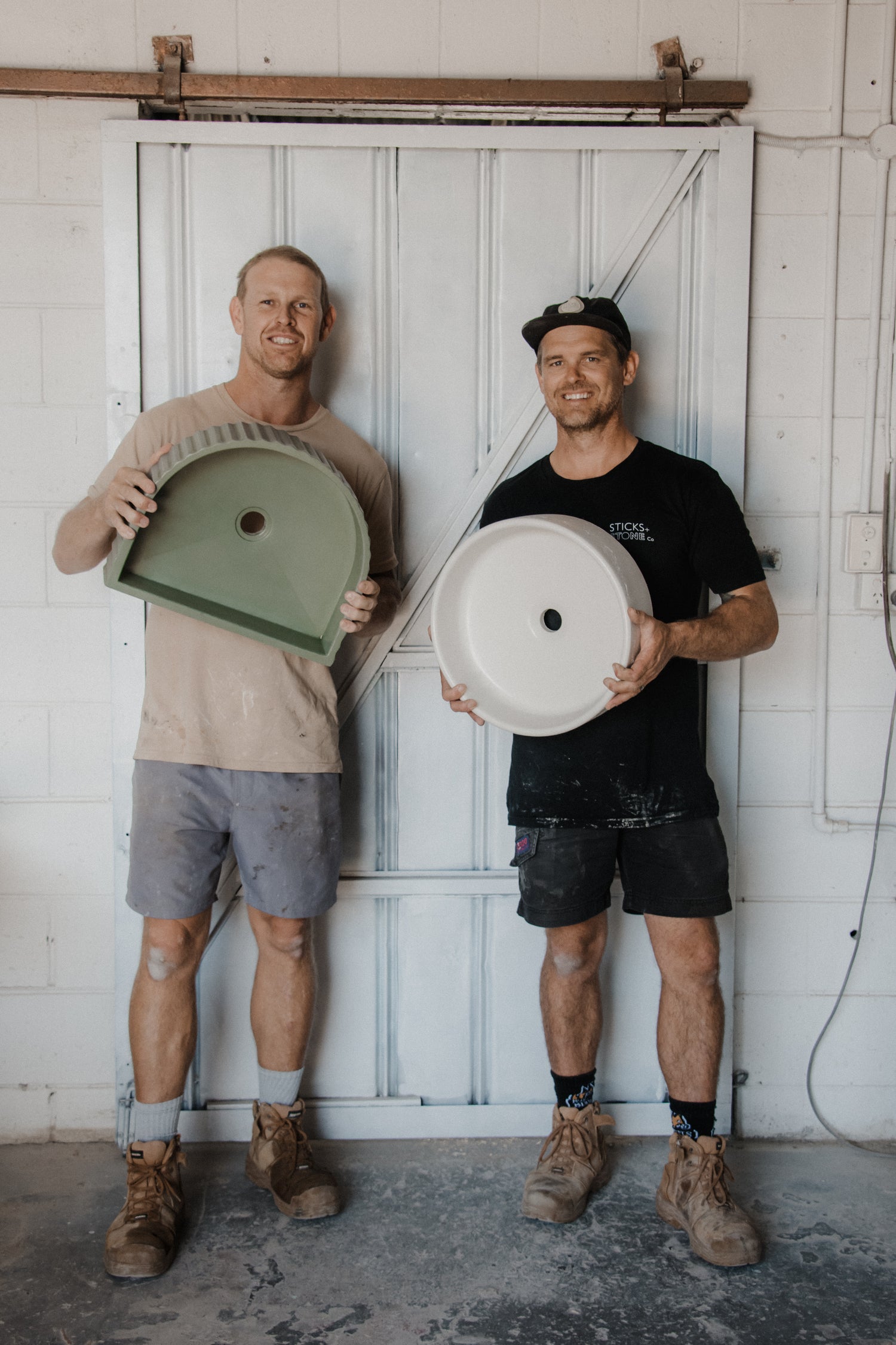 Tim & Dane from Sticks & Stones holding concrete basins